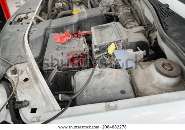 Automobile Engine close up. Repair and\
maintenance of the car engine in the\
service.