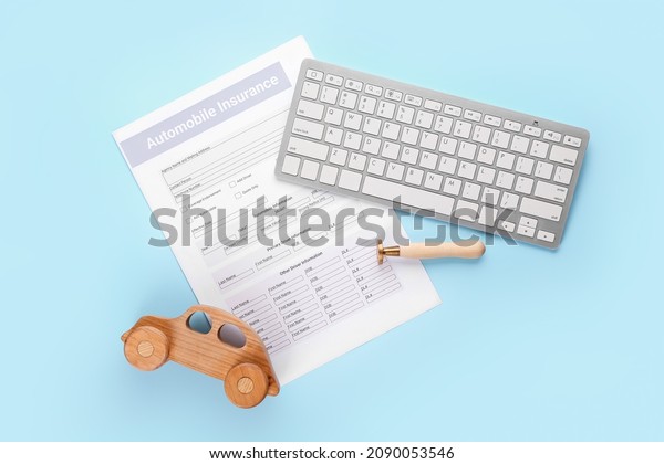 Automobile insurance with car figure and\
computer keyboard on color\
background