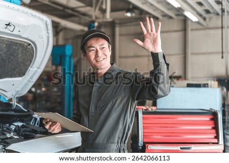 Automobile mechanic checking the engine compartment of a car - Acceptance inspection (vehicle inspection and regular inspection)
