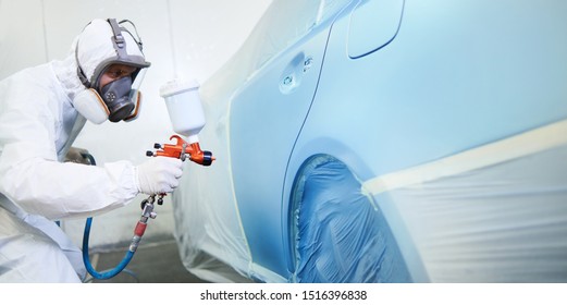 Automobile Painting. Car Painter With Gun In Chamber