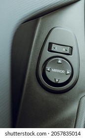 Automobile salon interior, close-up. Detail of buttons for raising and lowering car windows