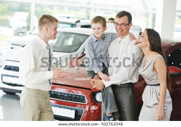 Automobile shopping.\
Family buying auto\
car