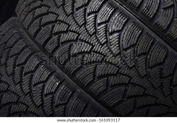 The automobile tire\
on a black background