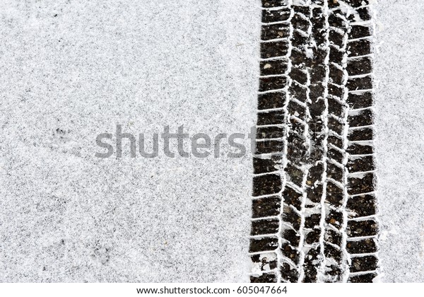 Automobile tire tracks in the\
snow