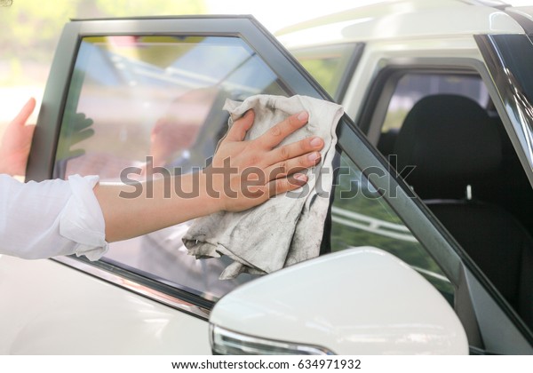 Automobile windshield wipe at car wash Closeup /\
Automobile windshield\
wipe