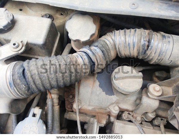 Automobile:Damaged Air Cleaner\
Hose Of A\
Car