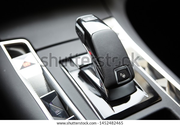 Automotive detail in a luxury car. Modern Luxury
car inside. Interior of prestige modern car. Automatic gear stick
shift