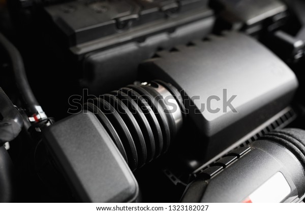 automotive\
engine air intake tube and filter\
housing