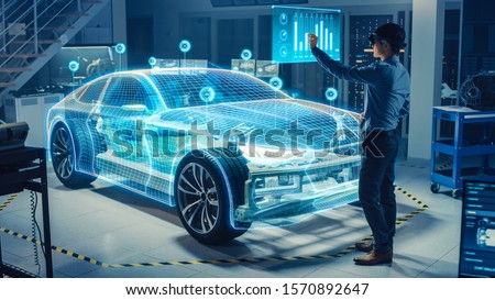 Automotive Engineer Use Virtual Reality Headset for Virtual Electric Car 3D Model Design Analysis and Improvement. 3D Graphics Visualization Shows Fully Developed Vehicle Prototype Analysed, Optimized
