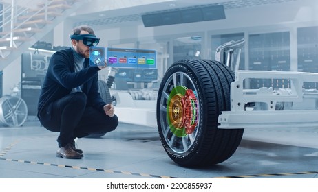 Automotive Engineer Working On Electric Car Chassis Platform, Using Augmented Reality Headset With 3D VFX Software For Development Of Regenerative Braking System On A Concept Transport Vehicle.