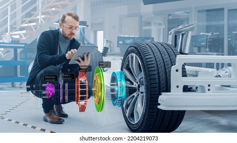 Automotive Engineer Working On Electric Car Chassis, Using Augmented Reality Headset With 3D VFX Application For Development Of Regenerative Braking System On A Futuristic Transport Vehicle.