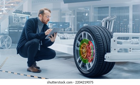 Automotive Engineer Working On Electric Car Chassis, Using Augmented Reality Headset With 3D VFX Software For Development Of Regenerative Braking System On A Concept Transport Vehicle.