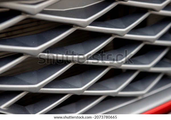 Automotive front grille. Air cooling.\
Ventilation. Close up. Pattern\
texture.