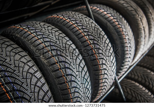 Automotive Industry New Car Tires Rack Inside Auto\
Parts Shop.