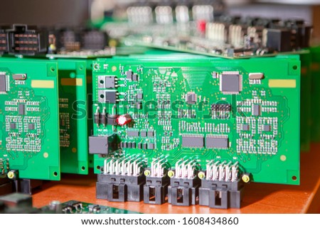 Automotive Printed Circuit Boards with Surface Mounted Components with PCBs On Top of Boards. Horizontal Image