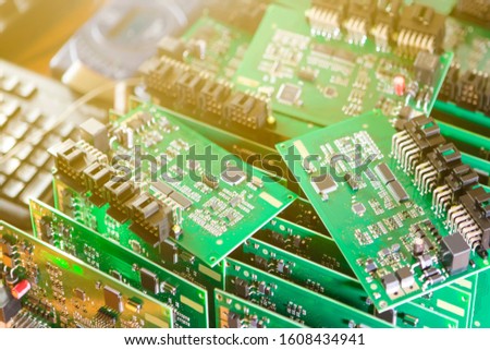 Automotive Printed Circuit Boards with Surface Mounted Components with PCBs On Top of Boards. Lens Flares Added. Horizontal Image Orientation