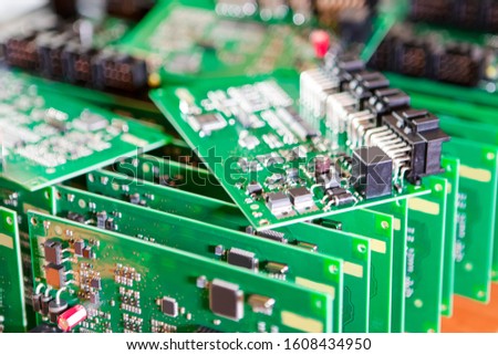 Automotive Printed Circuit Boards with Surface Mounted Components with PCBs On Top of Boards. Horizontal Image Composition