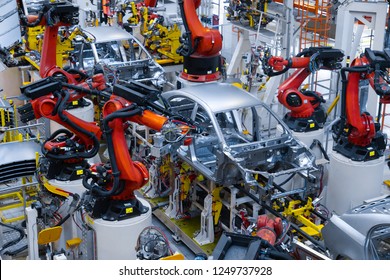 Automotive production line. Welding car body. Modern car Assembly plant - Shutterstock ID 1249737928