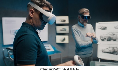 Automotive Professional Engineers With VR Glasses Talk About Vehicle Production While Standing In A High Tech Office. Car Design Analysis And Improvement.