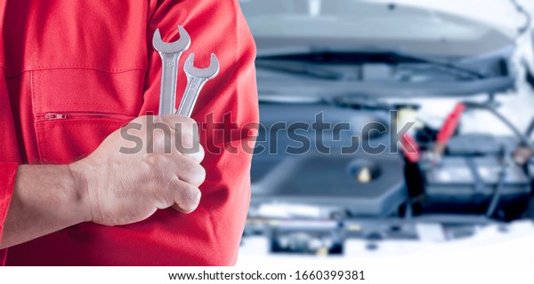 automotive service worker in\
workshop\
