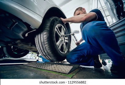 Automotive Suspension Test And Brake Test Rolls In A Auto Repair Service. Background