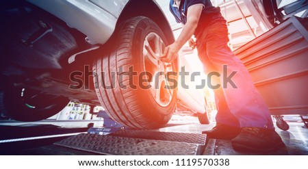 Automotive suspension test and brake test rolls in a auto repair service. Background