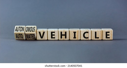 Autonomous Or Automated Vehicle Symbol. Turned Wooden Cubes And Changed Words Automated Vehicle To Autonomous Vehicle. Grey Background. Business Autonomous Or Automated Vehicle Concept, Copy Space.