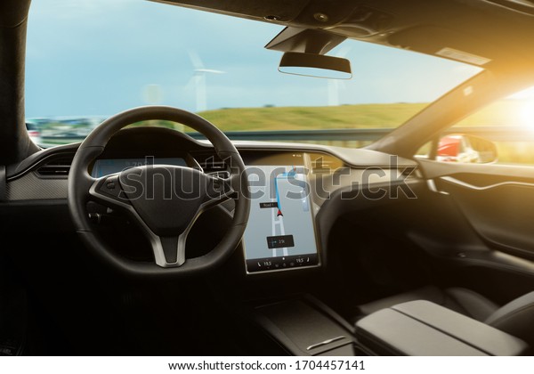 Autonomous car on a\
road. Self-driving\
vehicle