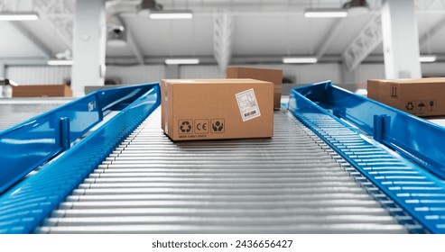 Autonomous Conveyor Belt Sorting Mechanism with Artificial Intelligence Capabilities Handling, Sorting and Preparing Parcels for Delivery to Online Clients in a Modern Logistics Warehouse - Powered by Shutterstock