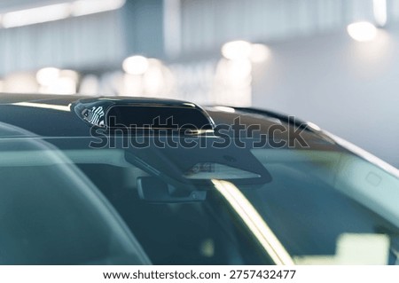 Autonomous driving technology with LiDAR sensor on car roof and ADAS cameras behind windshield