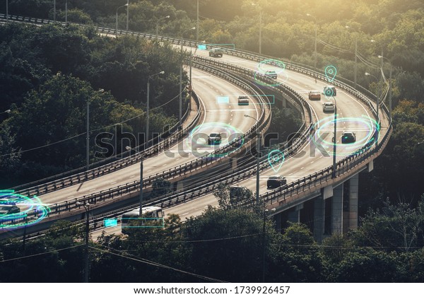 Autonomous\
Self Driving Cars Concept. Cars move on city road and Artificial\
Intelligence controls vehicles in\
traffic.