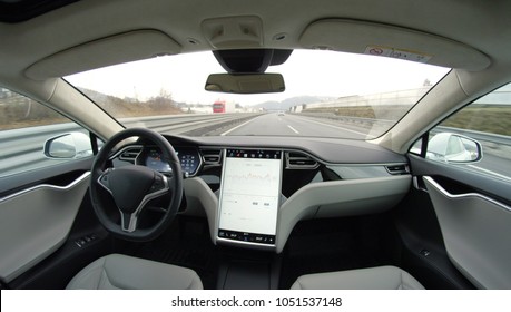 AUTONOMOUS TESLA CAR, FEBRUARY 2016:  Absolutely Autonomous Self-driving Autopilot Tesla Model S Driverless Car With Next Gen Ultrasonic Sensors, Cameras And Radars Driving Along The Turnpike Highway