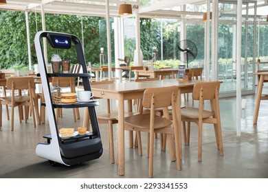 Autonomous waiter robot working in restaurant, Artificial intelligence 5G technology concept - Shutterstock ID 2293341553