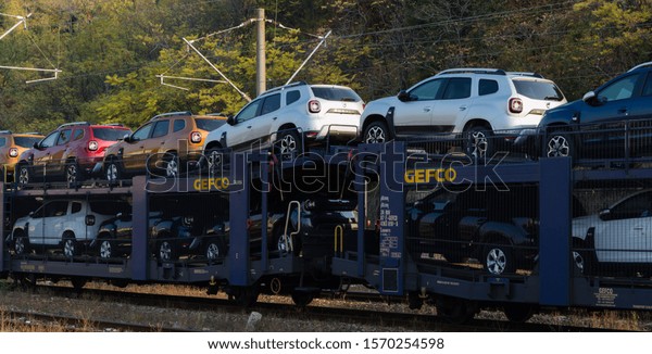 Autorack with new cars for export at GEFCO - Global\
and international logistics. Cars transported on railway platforms.\
New cars transported by train. New cars Dacia Duster.\
Orsova,\
October 25, 2019\
