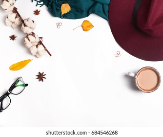 Autumn accessories for woman with yellow leaves and coffee with milk, top view - Powered by Shutterstock