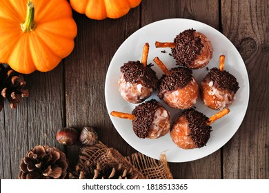 Autumn Acorn Shaped Pumpkin Spice Donut Holes. Top Down View Table Scene On A Rustic Wood Background.