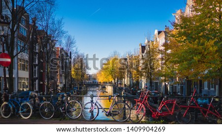 Similar – Foto Bild Architektur niederländischer Häuser Fassade und Hausboote am Amsterdamer Kanal