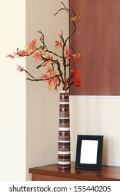 Autumn Arrangement In A Vase On The Table And Photoframe With Place For Your Foto.