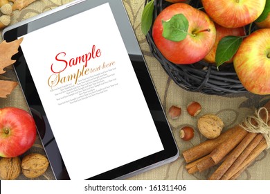 Autumn Background Basket With Apples And Tablet