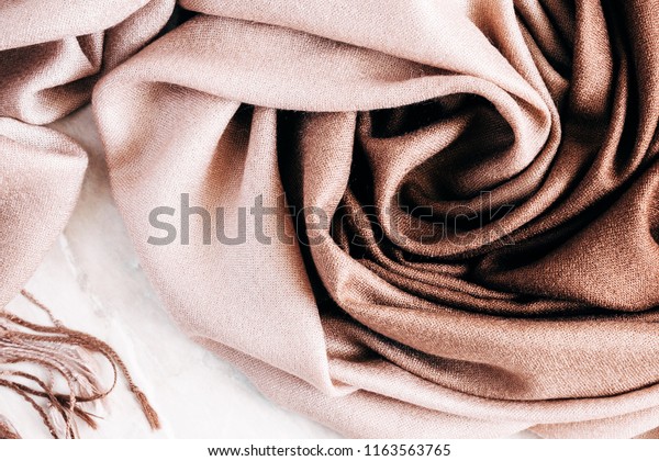 Autumn background. Beautiful elegant brown scarf.\
Flat lay, top view