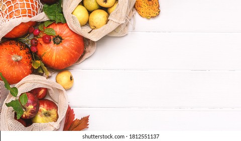 Autumn background with pumpkins and fruits. Pumpkins, apples and pears in shopping bags on a white background top view. Free space for text. Autumn shopping. Thanksgiving Day. - Powered by Shutterstock
