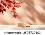 
Autumn background scene with red maple leaves and wooden podium stand. Natural seasonal home decor for fall season showroom.