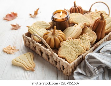 Autumn baking. Cookies in the form of pumpkin and leaves on the table. Cozy autumn concept. - Powered by Shutterstock