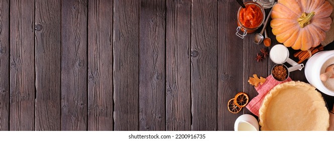 Autumn Baking Side Border With Pumpkin Pie Ingredients. Overhead View On A Dark Rustic Wood Banner Background With Copy Space.