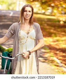 Autumn Beauty. Shot Of An Attractive Young Woman In The Park On An Autumn Day.