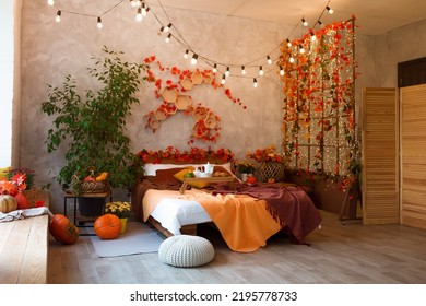 Autumn Bedroom, Living Room Interior. Red And Yellow Leaves And Flowers In The Vase And Pumpkin On Light Background.