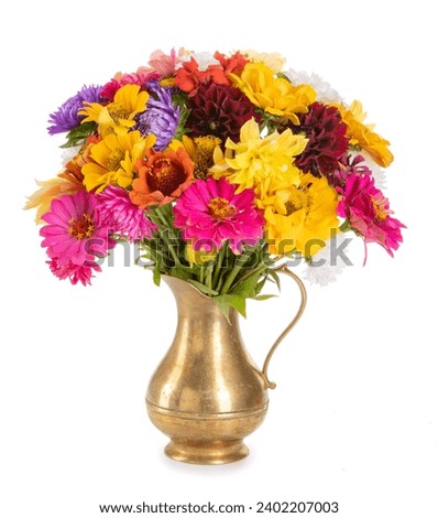 autumn bouquet isolated on white background. zinnias, asters in an antique copper vase.