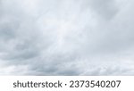 Autumn brings overcast skies adorned with gray stratus clouds, hinting at impending rain. This full-screen view provides ample space for text or design elements, making it perfect for various projects
