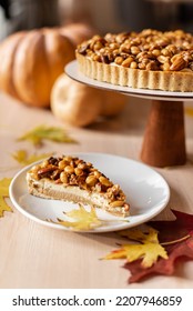 Autumn Cake With Nuts And Caramel, Tart, Cup Of Coffee, Fallen Leaves, Pumpkin, Cup Of Coffee, Cozy Breakfast In Cold Weather, Piece Of Pie, Winter Menu Of Confectionery, Coffee Shop, Peanut