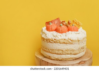 Autumn Cake With Pumpkins Staying On The Wood On Yellow Background, Thanksgiving Cooking